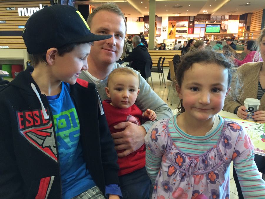 Dad and the kids together at the shopping centre