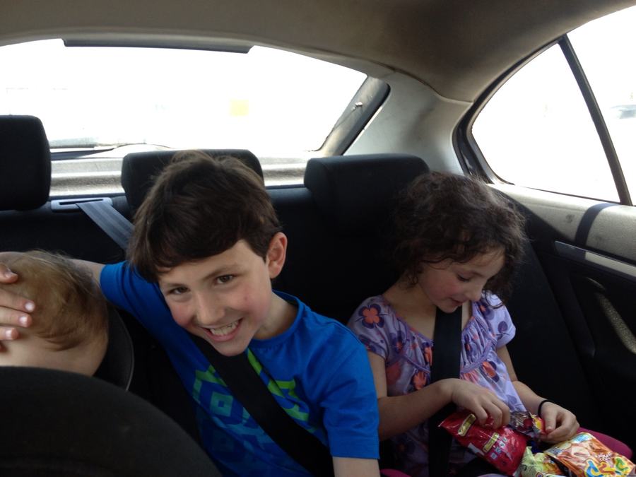 Kids laughing in the back seat of the car