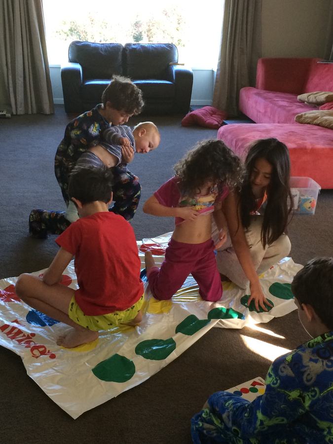 Children in the middle of a Twister game