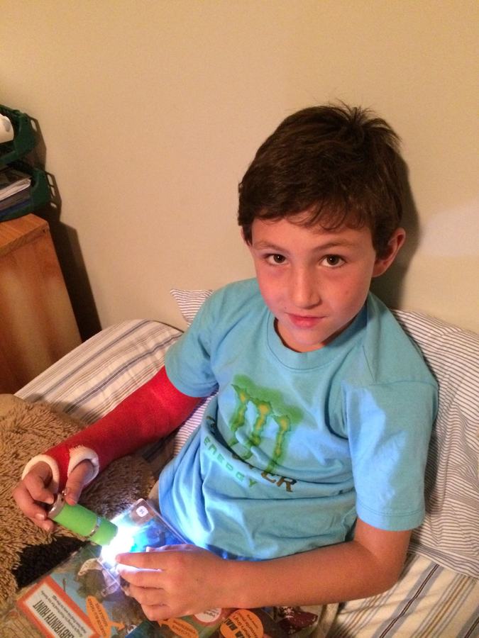 Boy on the sofa playing with a light-up toy